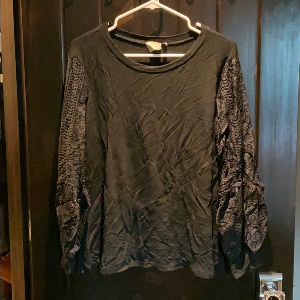 Cute lace sleeve.Never worn.yes washed.